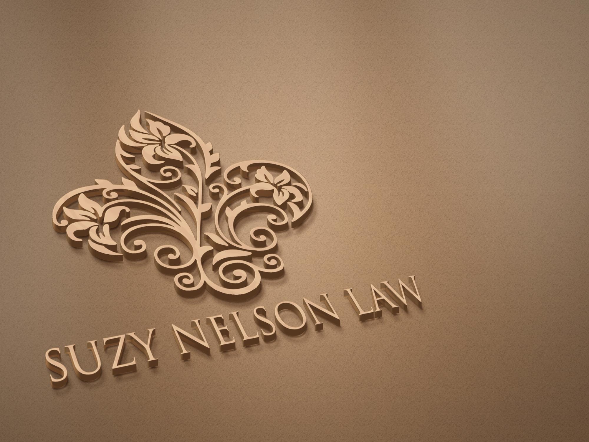 The Suzy Nelson Law fleur-de-lis and name in gold relief